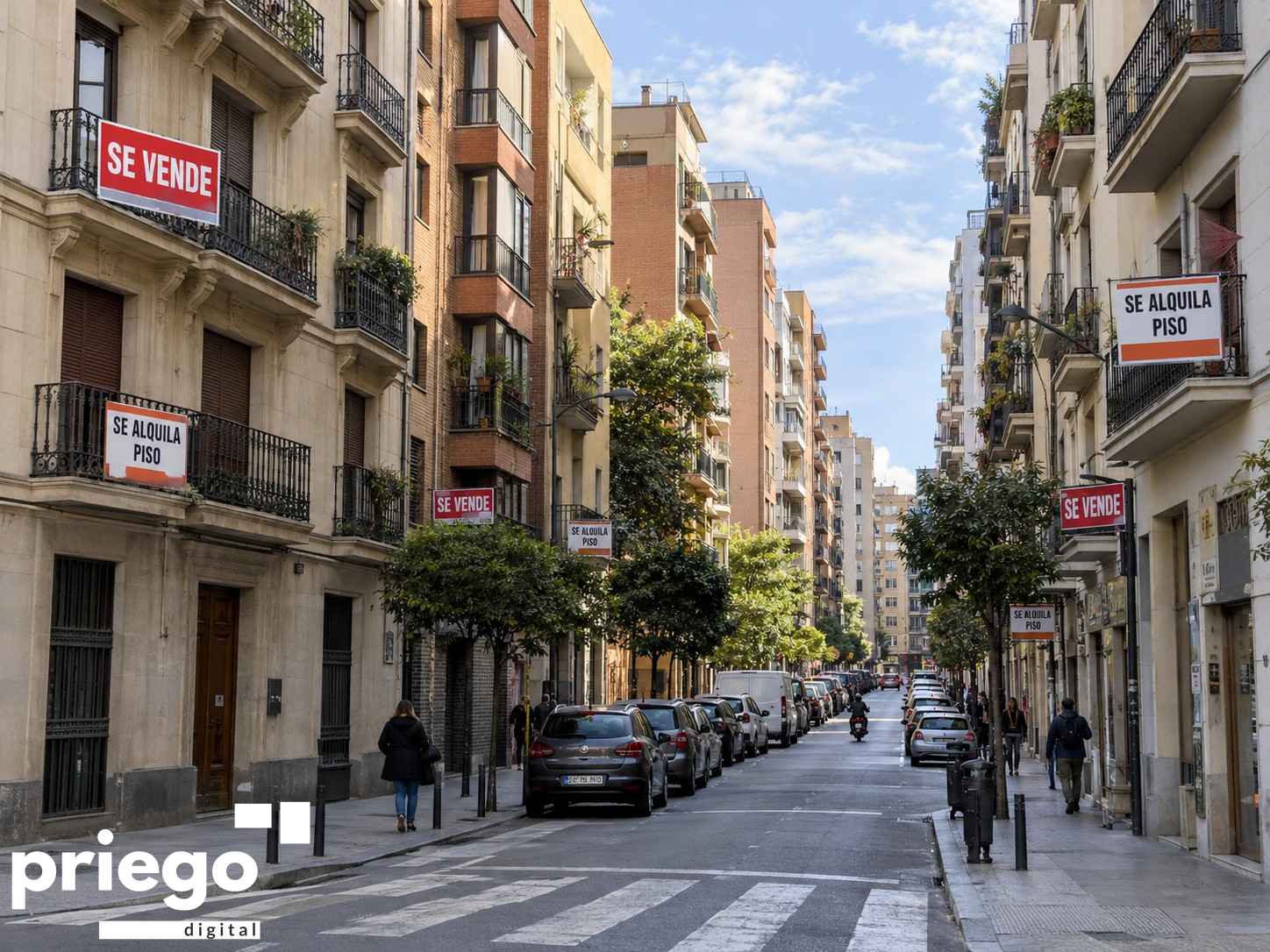 Carteles de venta y alquiler de pisos en una calle.